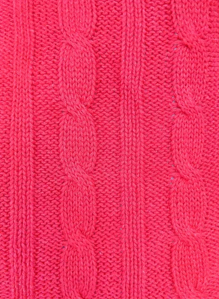 Pink knitted texture background. Pattern of wool knitting for wallpaper and an abstract background