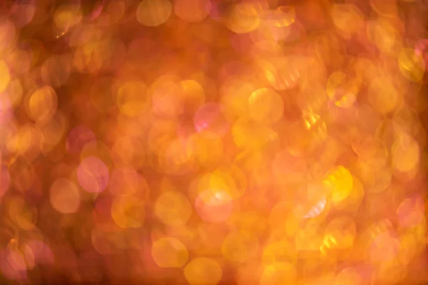 Pomarańczowe złoto abstrakcyjne tło z bokeh nieostre światła — Zdjęcie stockowe
