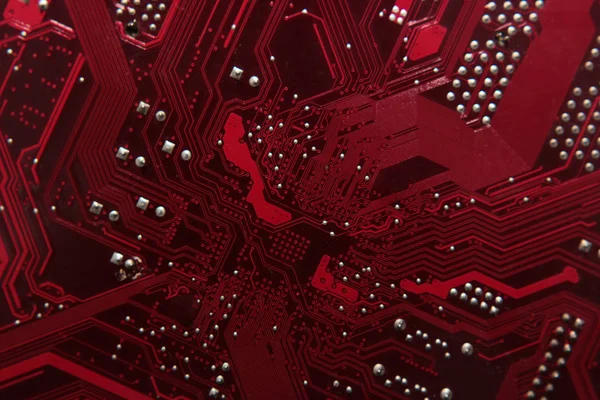 Circuit board. Electronic computer hardware technology. Motherboard digital chip. Tech science background. Integrated communication processor. Information engineering component. Red color.