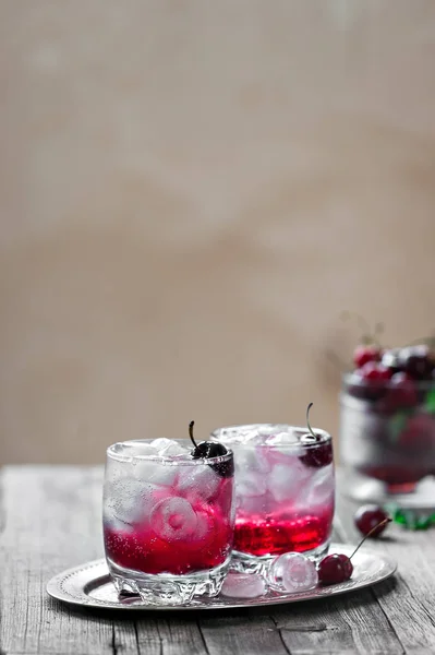 A cocktail with gin,  cherry syrup — Stock Photo, Image