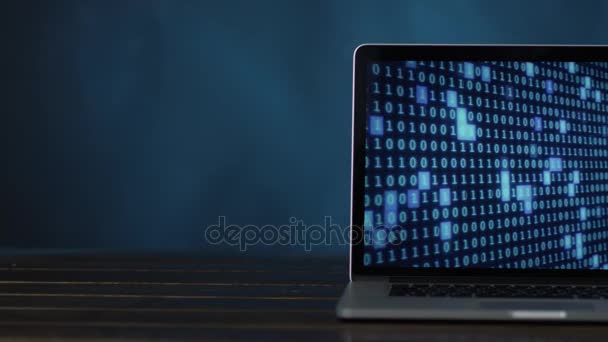 Laptop med blå färgade digitala binära koden på hälften — Stockvideo
