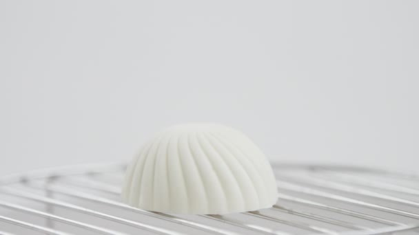 White cake in the form of seashell — Stock Video