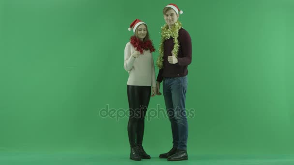 Cheerful couple showing approve sign, chroma key on background — Stock Video