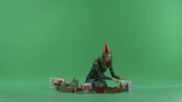 Attractive young woman got a good Christmas present, chroma key on background — Stock Video