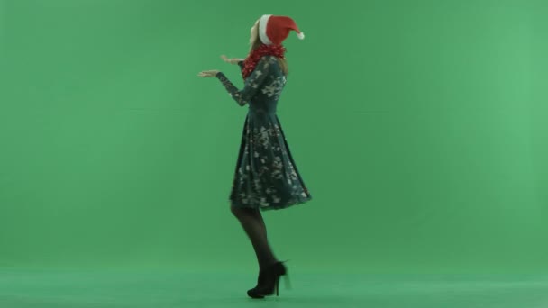 Young woman dances with snowflakes falling on her hands, chroma key on background — Stock Video