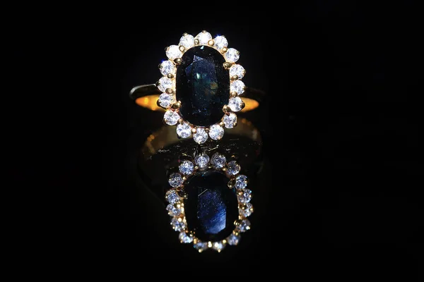 Jewellery diamond ring and gemstone on a black background — Stock Photo, Image