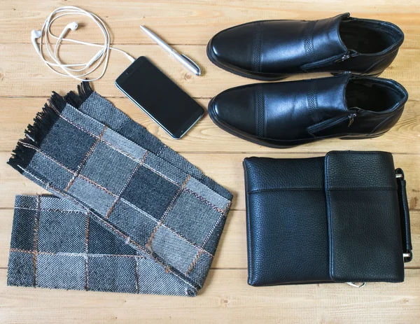 Business accessories for men on the wooden floor.