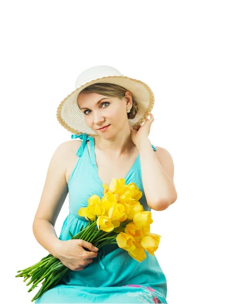 Woman with flowers adjusts her hat isolated on white background. Royalty Free Stock Images