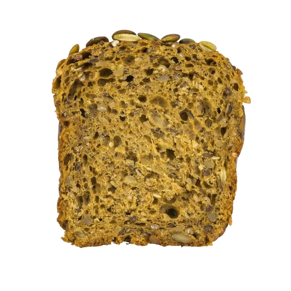 Un morceau de pain de farine de blé avec du son et des graines de citrouille, des graines de sésame, des noix isolées sur fond blanc . — Photo