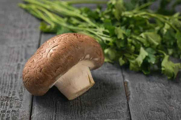 Large Royal champagne with parsley leaves on a black wooden table. Vegetarian food. — Stock Photo, Image