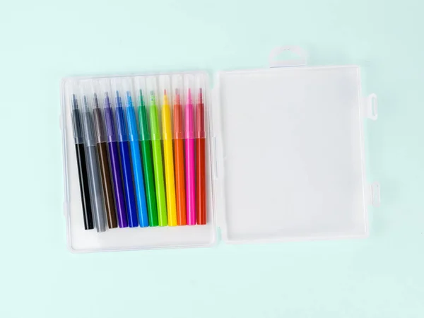 Open package with a set of markers on a light background. — Stock Photo, Image