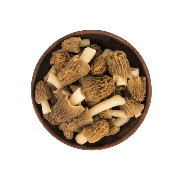 Clay bowl with fresh morels isolated on a white background. — Stock Photo, Image