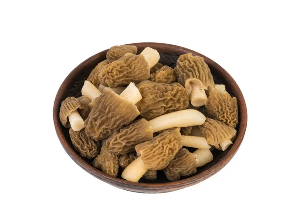 A small clay bowl with morels isolated on a white background. — Stock Photo, Image