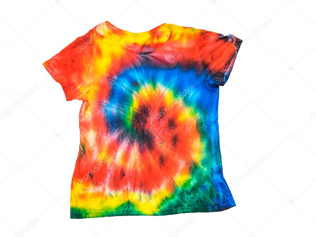 T-shirt in a bright tie dye style isolated on a white background. Flat lay. Pastel color.