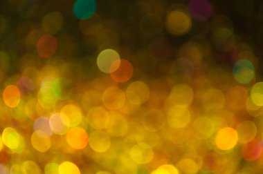 Altın ve sarı bokeh dağınık