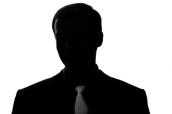 Portret jonge man in pak, binden in silhouet - vooraanzicht — Stockfoto