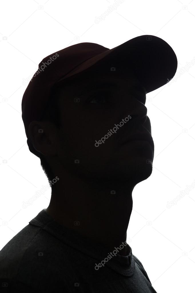 Portrait of a young man in cap, side view