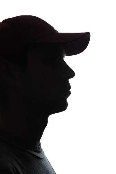 Porträt eines jungen Mannes mit Mütze, halbe Ansicht — Stockfoto