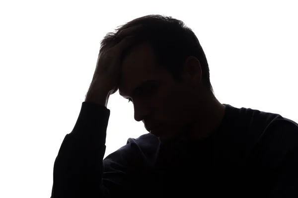 En ung man med sorg slita på håret — Stockfoto