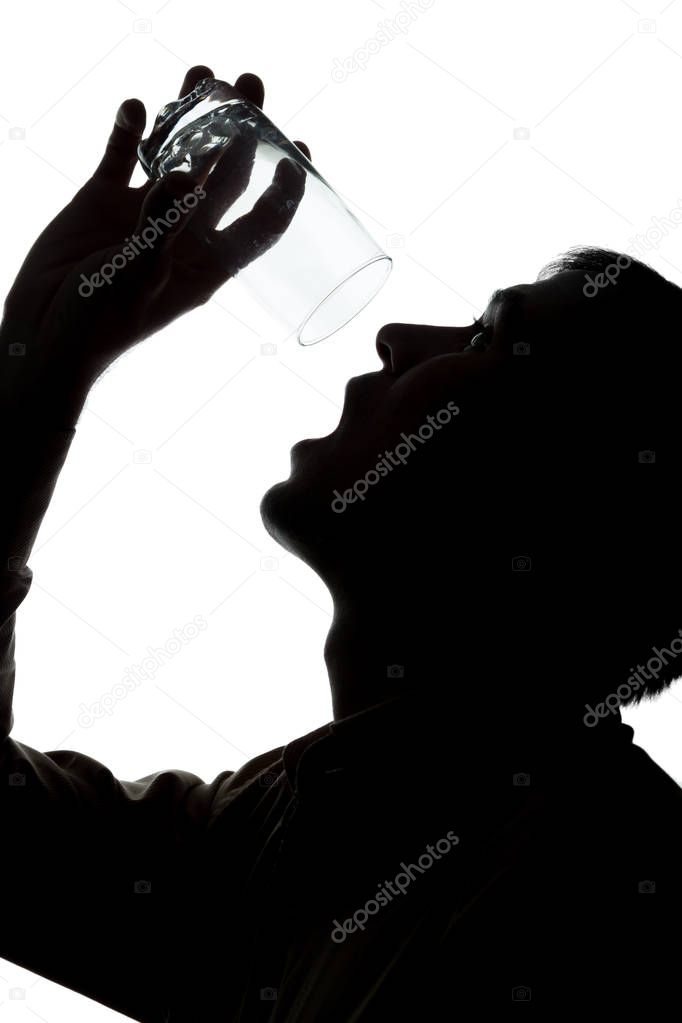 Young man drinks soda water, no water - silhouette