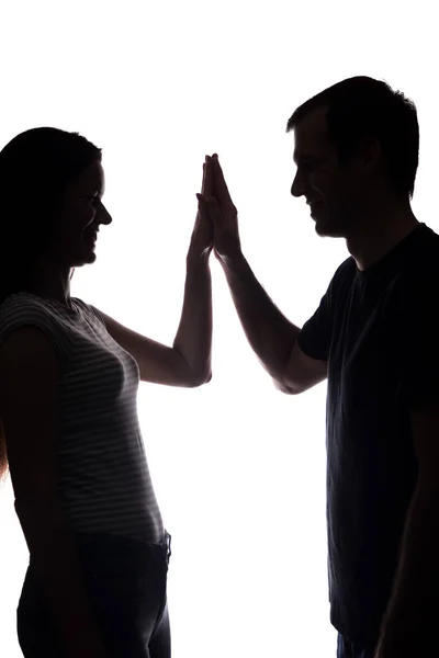Women and men across from, brother and sister - silhouette — Stock Photo, Image
