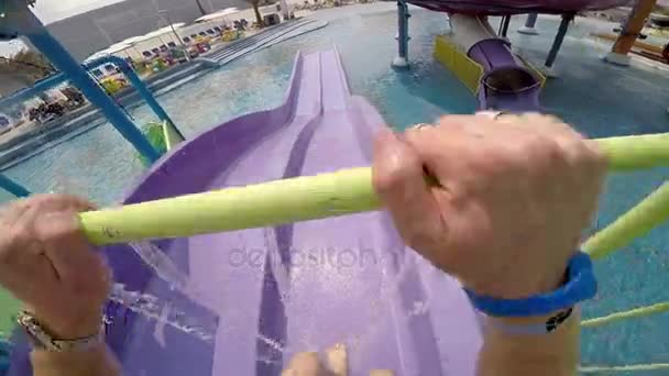 Enjoyment on the water slide in aqua park. Legs. — Stock Video