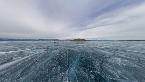 Wide view in motion texture ice lake and a small island