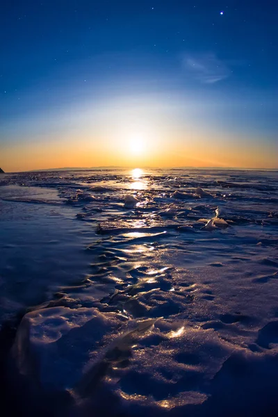 Textured tile blue ice hummock of Lake Baikal at moon light. Olk — Stock Photo, Image