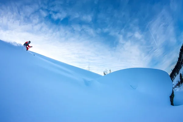 Freerider skier descends from the mountain in the light of the m — Stock Photo, Image