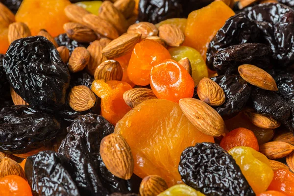 prunes, dried apricots, dried mandarins and almonds close-up