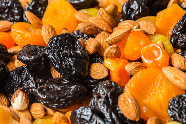 prunes, dried apricots, dried mandarins and almonds close-up