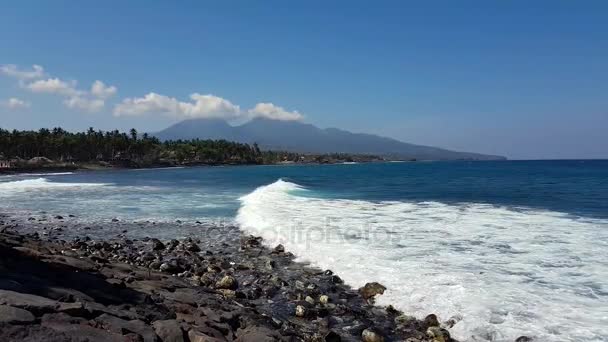 View from the shore of the ocean to Active volcano Gunung Agung in Bali, Indonesia. — Stock Video
