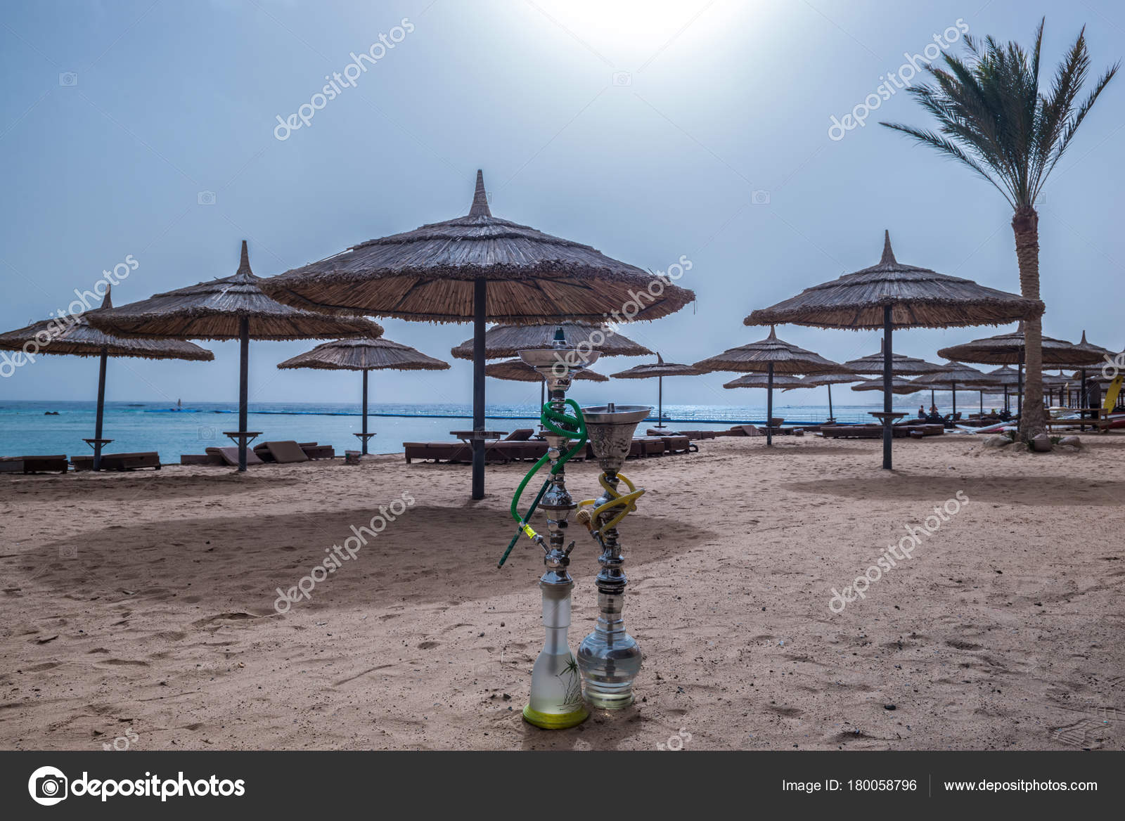 Two shisha hookahs on the sandy beach of Red Sea in Sharm El Sheikh