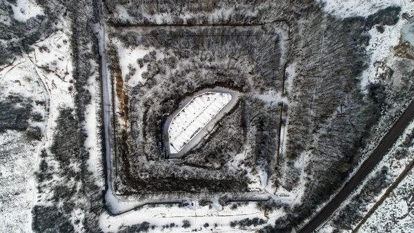 Aerial view of beautiful ancient fortress in forest in winter. Tarakaniv Fort. — Stock Photo, Image