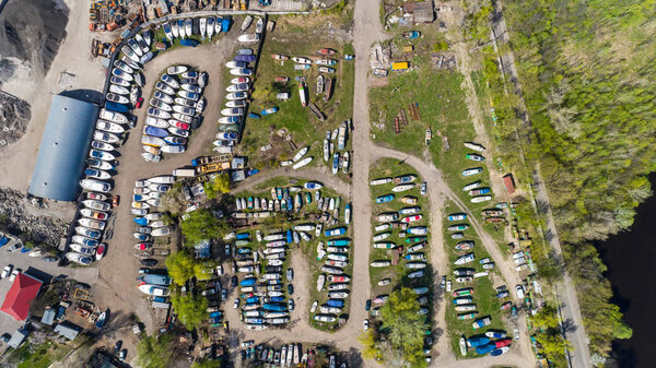 Aerial view of boats on land near the harbor