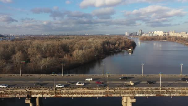 Beautiful Aerial View of City Traffic on the Bridge at the Sunny Day in winter. — Stock Video