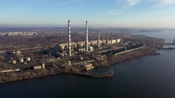 Aerial view of garbage incineration plant. Waste incinerator plant with smoking smokestacks. Camera moving from left to right. — 비디오