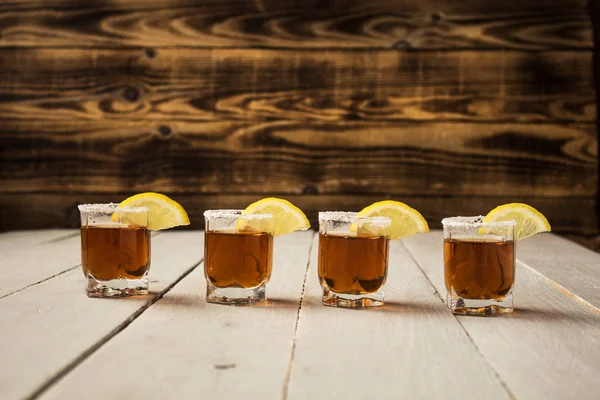 Alcohol shot drinks with lemon and salt — Stock Photo, Image