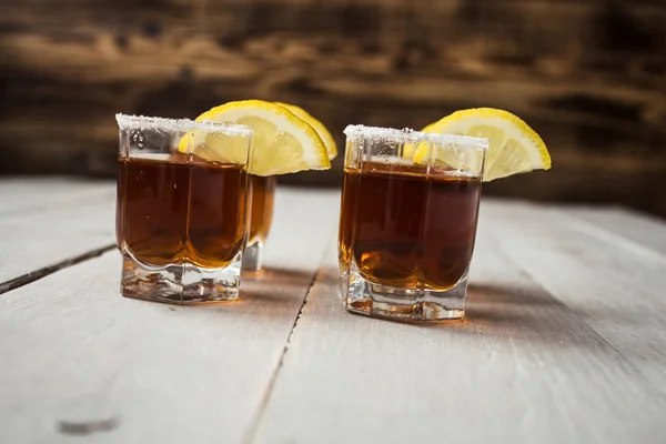 Alcohol shot drinks with lemon and salt — Stock Photo, Image