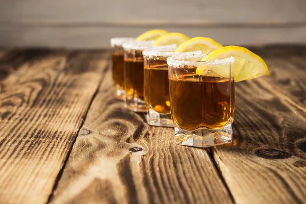 Alcohol shot drinks with lemon and salt — Stock Photo, Image