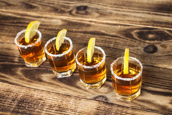 Alcohol shot drinks with lemon and salt — Stock Photo, Image