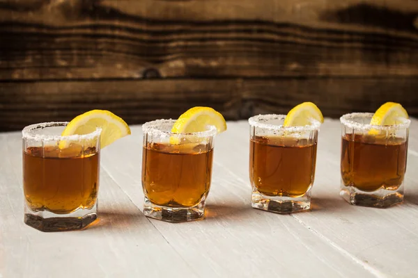 Alcohol shot drinks with lemon and salt — Stock Photo, Image