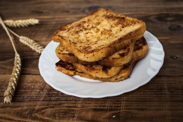 Stack of french toast on wooden background — Stock Photo, Image