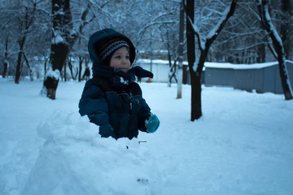 Litle boy to played with snow — Stock Photo, Image