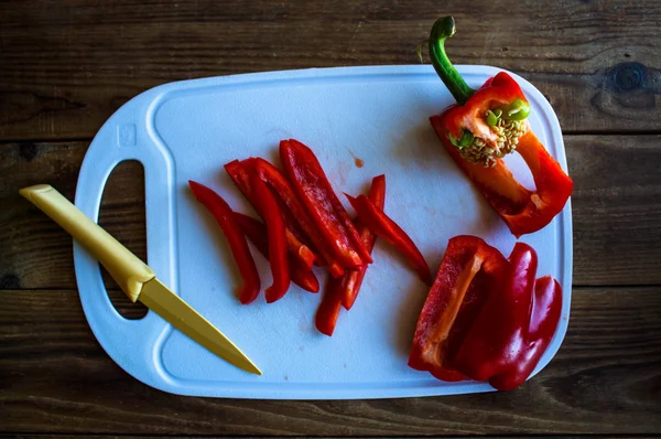 Chopped pepper on the tip with knife — Stock Photo, Image