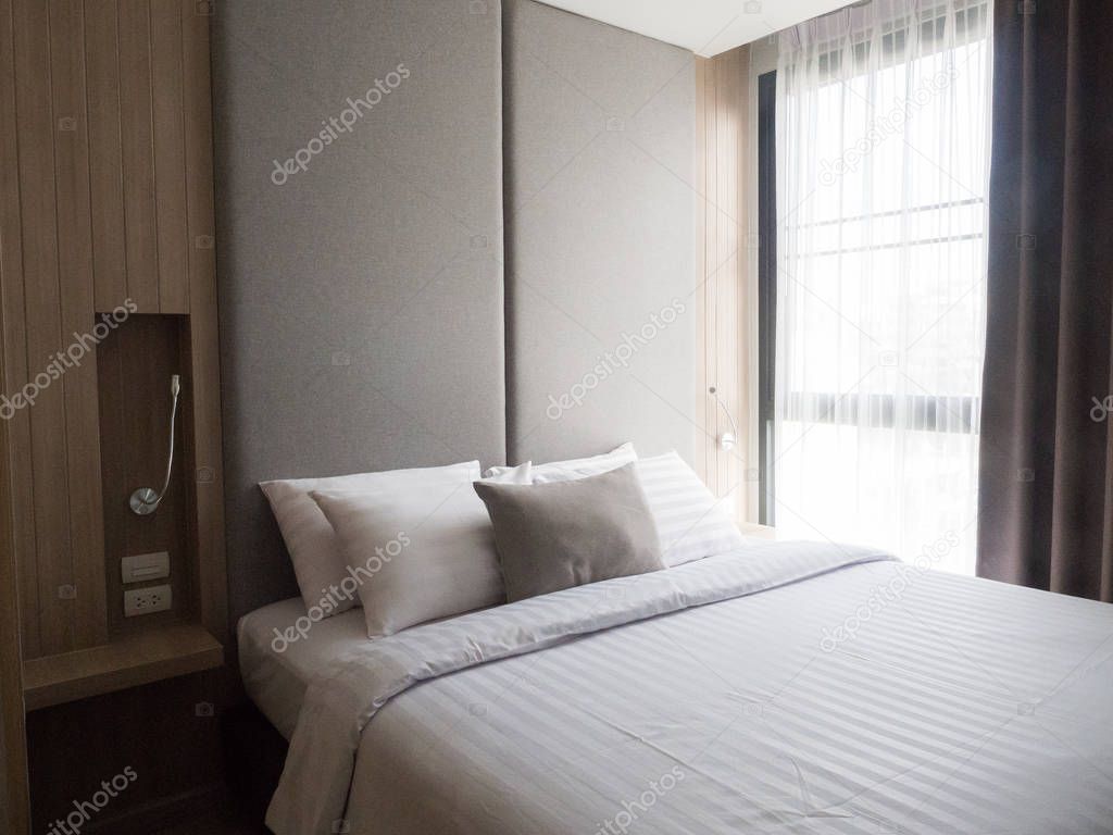 Interior of cozy bedroom in modern design.low lighting and Lens 