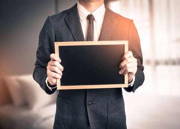 Young man giving hand on black background.Hands open businessman