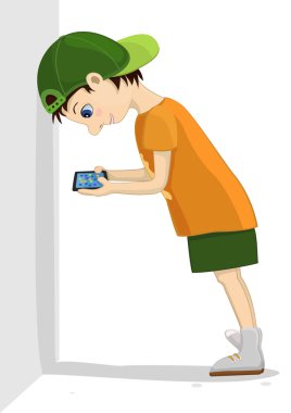 Bilgisayar bağımlısı çocuk bir duvara eğilir ve dikkatle onun tablet vasıl görünüyor. Oyun ve internet bağımlılığı. 