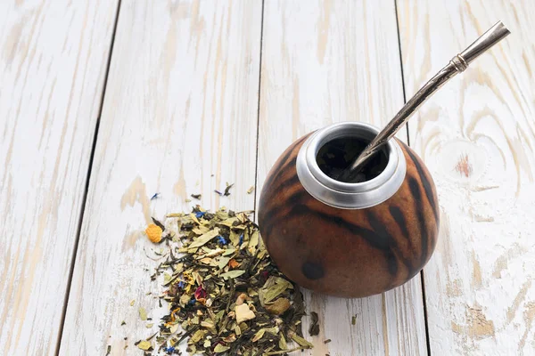 Yerba mate tea in a wooden mate calabash
