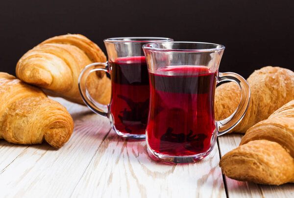 Fresh Croissants and cups of hot hibiscus tea